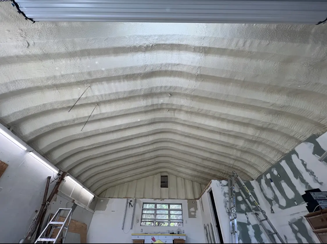 Spray polyurethane foam applied to the underside of a metal roof deck in Hazlet